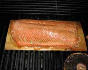 Grilling salmon on a cedar plank Grilling salmon on a cedar plank