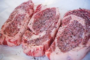 rib eye steak salted and peppered