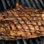 Marinated flank steak on the grill