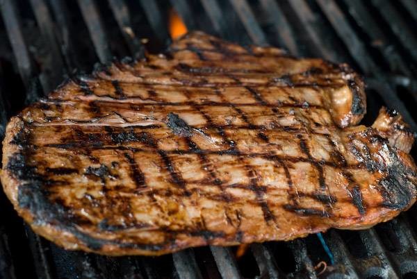 Marinated flank steak on the grill