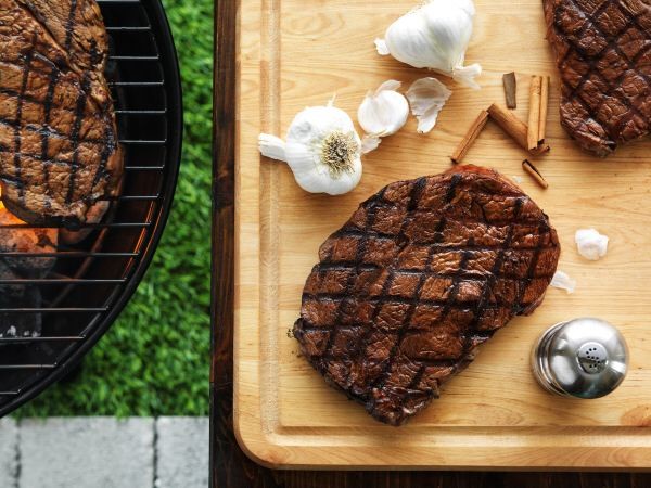 Grilled steak on cutting board